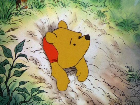Winnie-the-Pooh can't get out of Rabbit's hole. Aww.